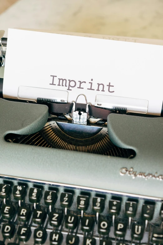 a typewriter with the words imprint on it
