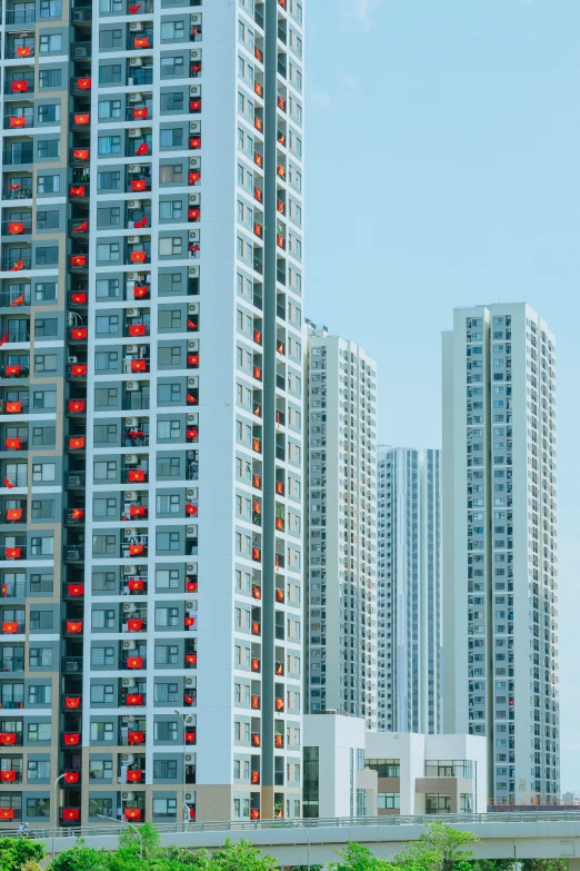 a row of tall buildings sitting on the side of a road