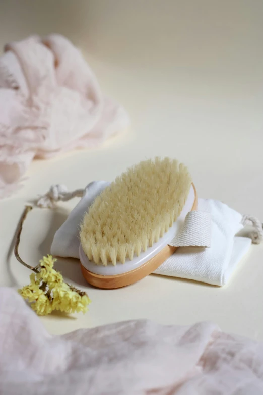 there is a hair brush that is on a piece of cloth