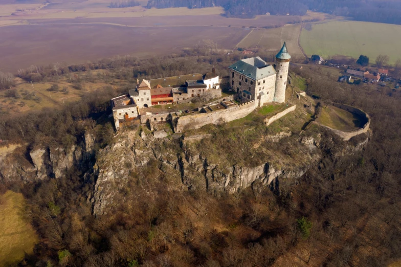 the castle is perched on top of a high cliff