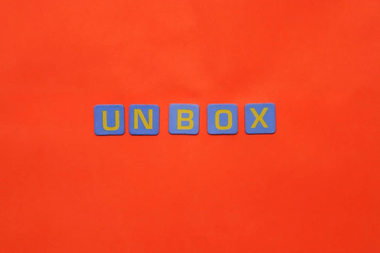 a close up view of the letters unbox made from plastic