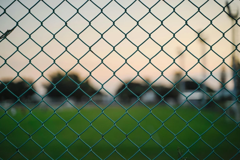 a fence is shown with a small green field