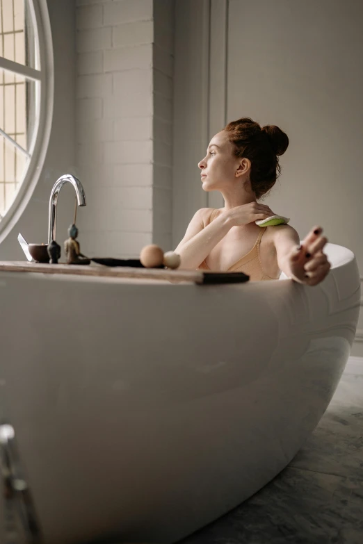 a woman who is in a bath tub