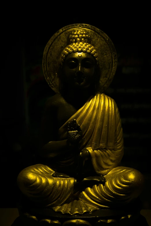 there is a statue of buddha with glowing eyes