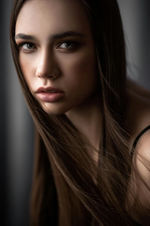 a beautiful woman with long hair on black background