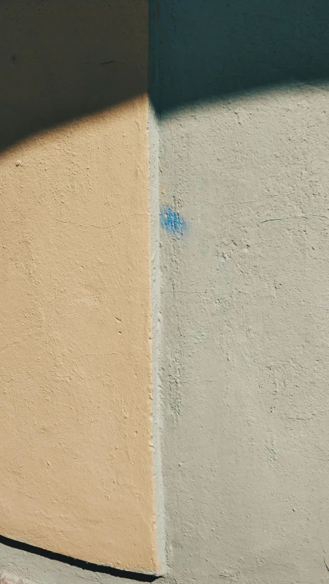 a stop sign painted blue on the side of a building