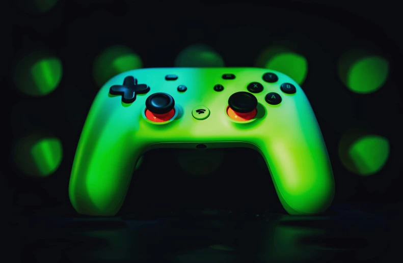 a green game controller with multiple colored ons