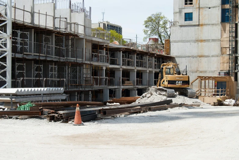 the back side of a building being constructed with construction equipment on it