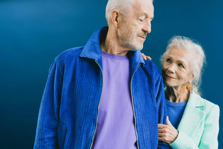 an elderly couple looking at each other