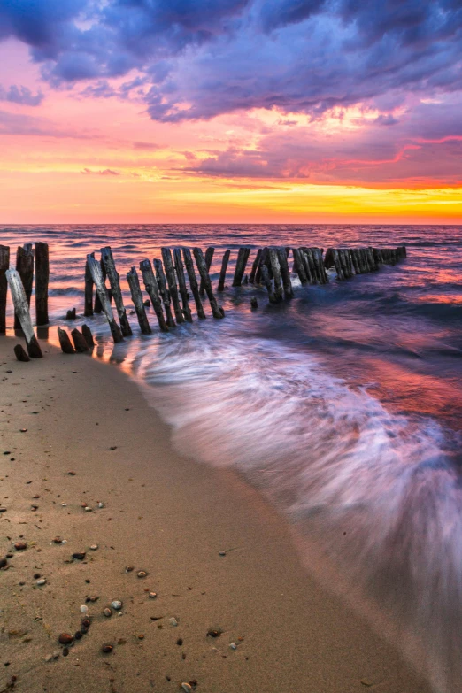 a wooden pole sticking out of the water