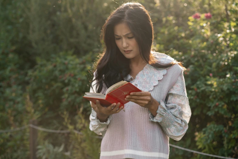 an image of a woman reading a book