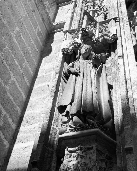 a statue is placed on top of a building