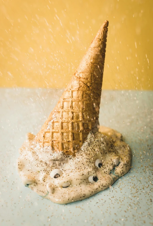 an ice cream cone that is on top of a cookie