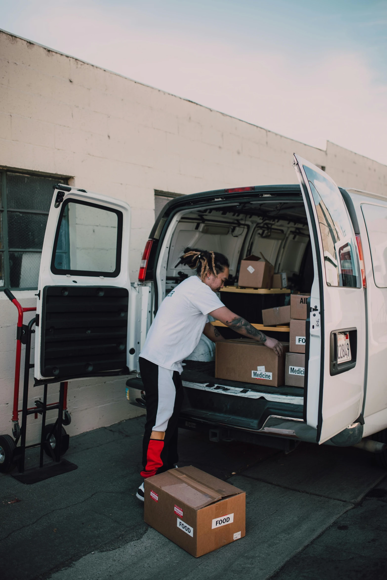 a person moving some boxes in a van