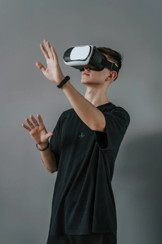 a person with a virtual - viewer, on their hand