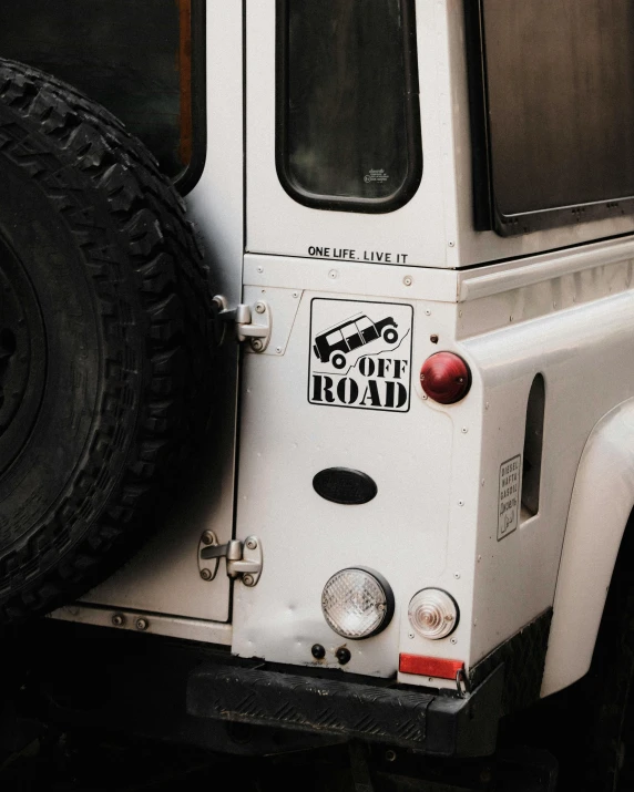 white truck parked with tire and windows