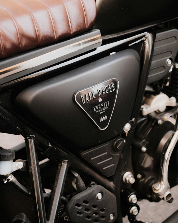 a motorcycle parked in a room with brown seats