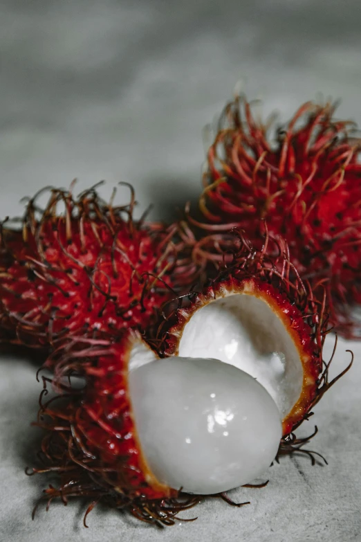 a fruit is opened and sitting on a white surface