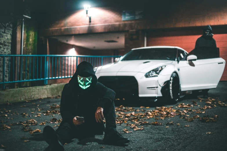 a person in a green mask and a white car