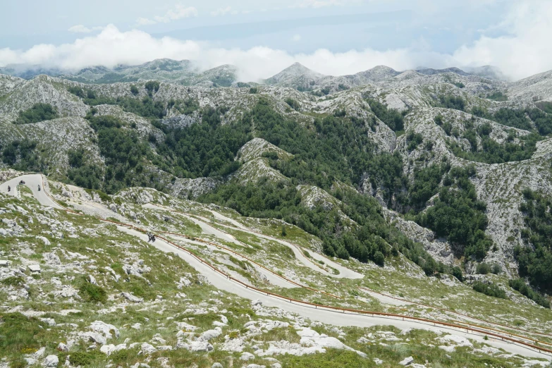 several very large mountains and roads next to each other