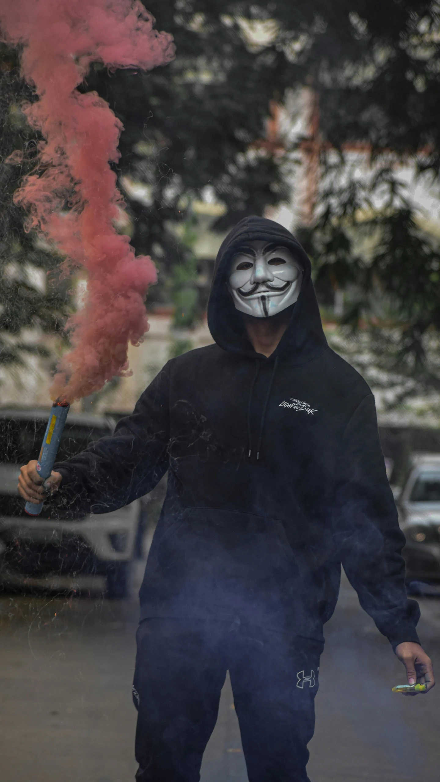 a man in a mask walking down a street