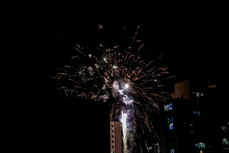 fireworks with many lights lit up in the dark night sky