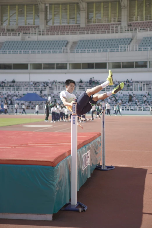 an olympic hurdle jumper performing a trick