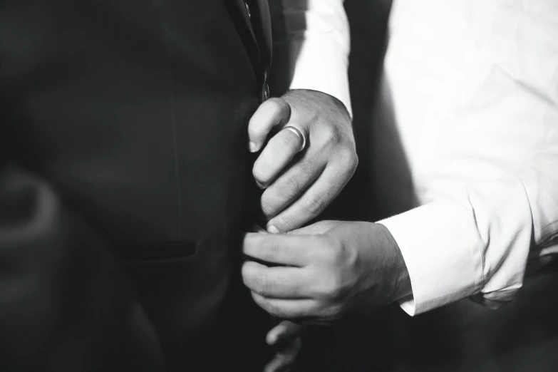 close up of the hands of a man and woman