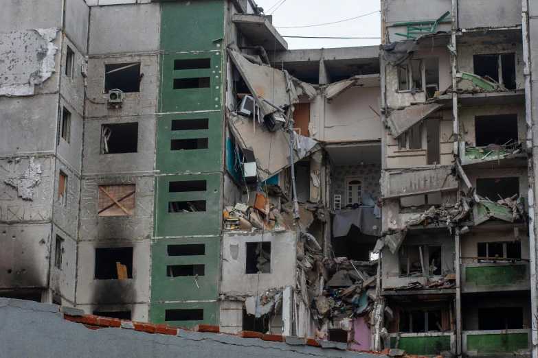 a very large building with many windows and debris on it