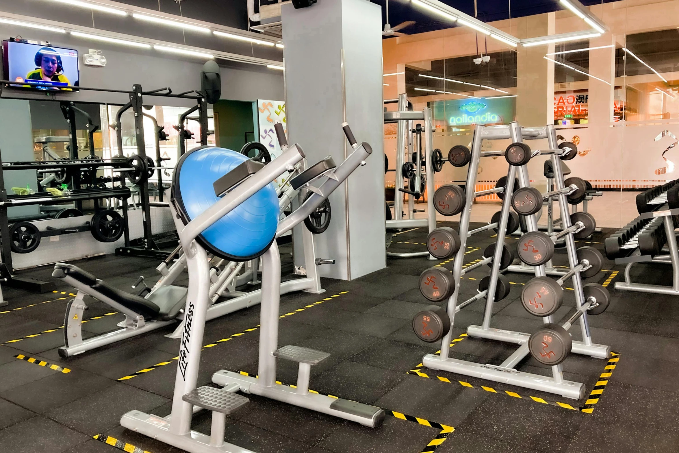 an empty gym is set up with equipment