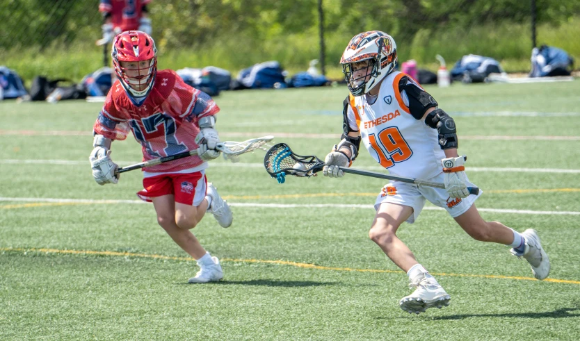 a lacrosse player running to get the ball during a game