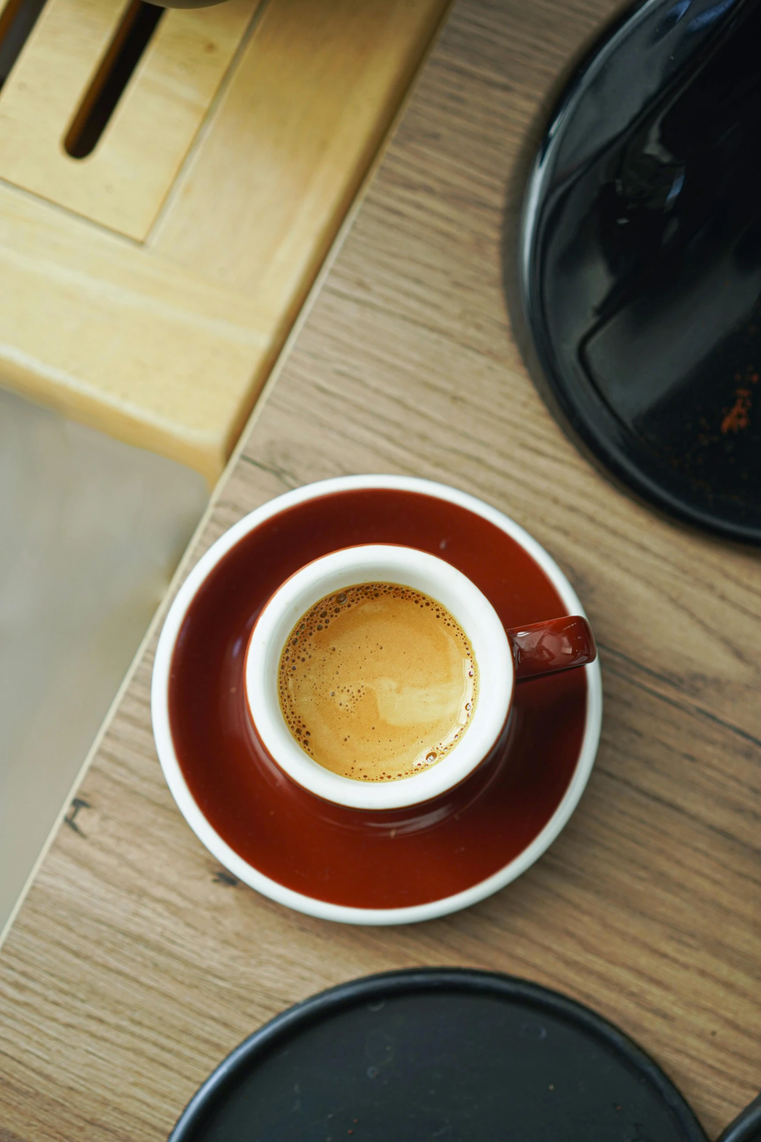 there is a brown and white cup and saucer