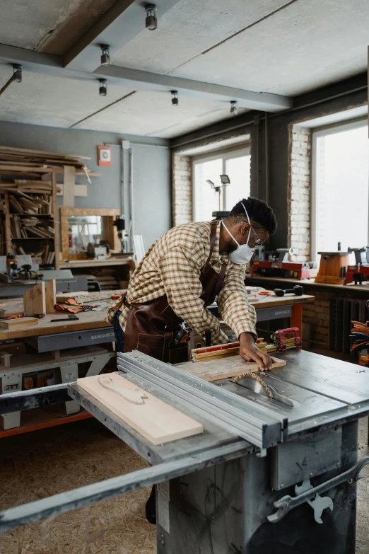 a woman wearing a mask and  wooden furniture