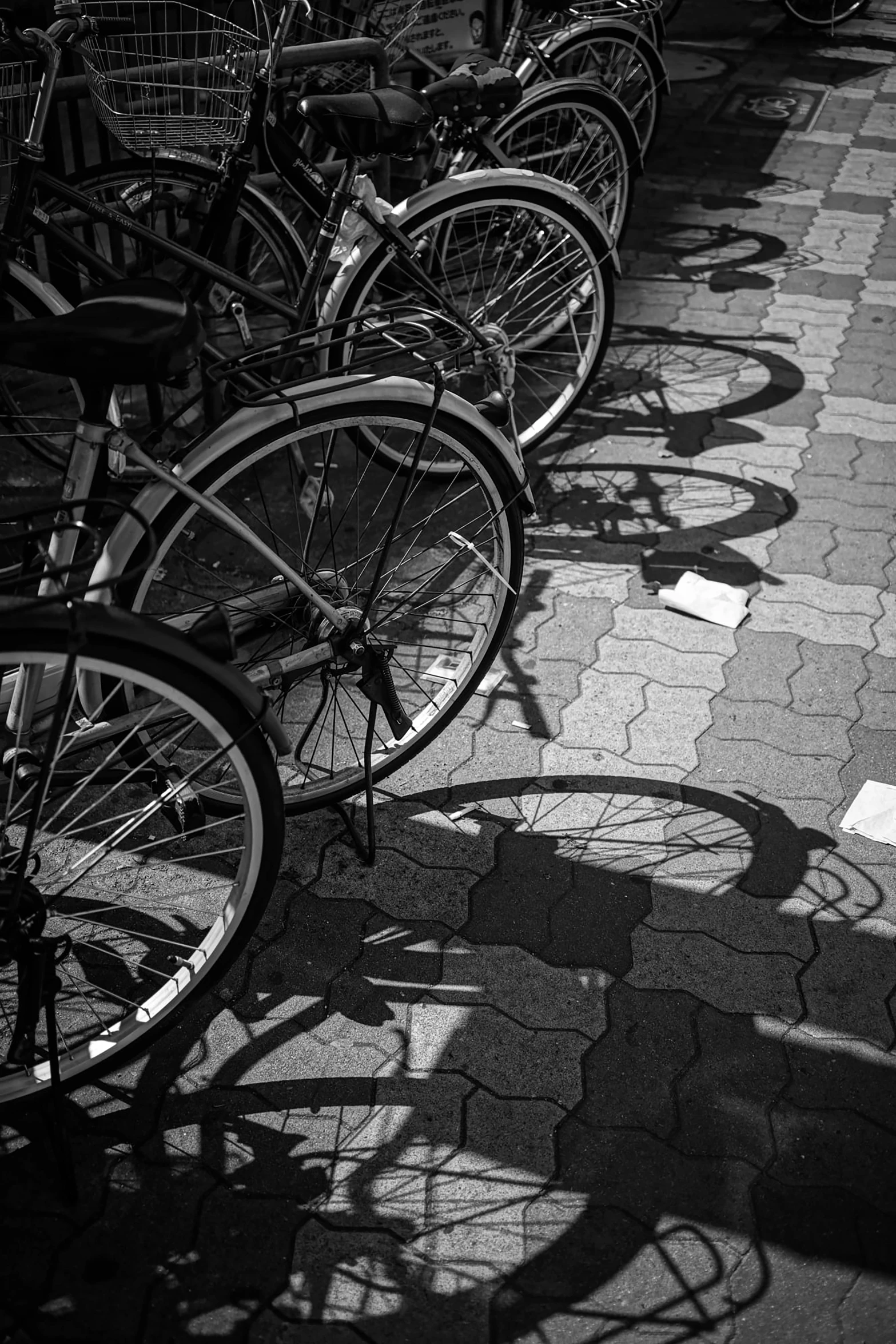 several bikes parked next to each other near the curb