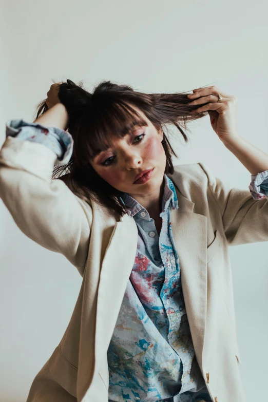 a woman holding her hair up and posing