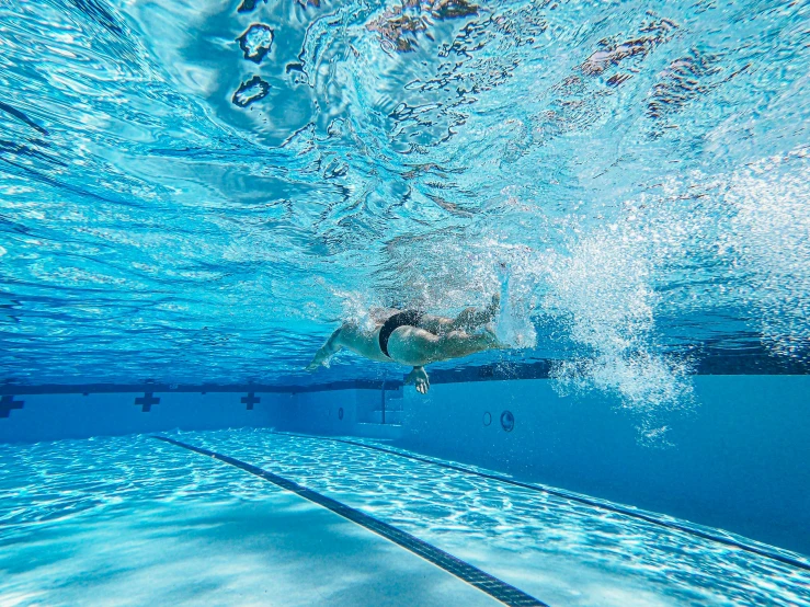 a swimming pool full of people as viewed from below