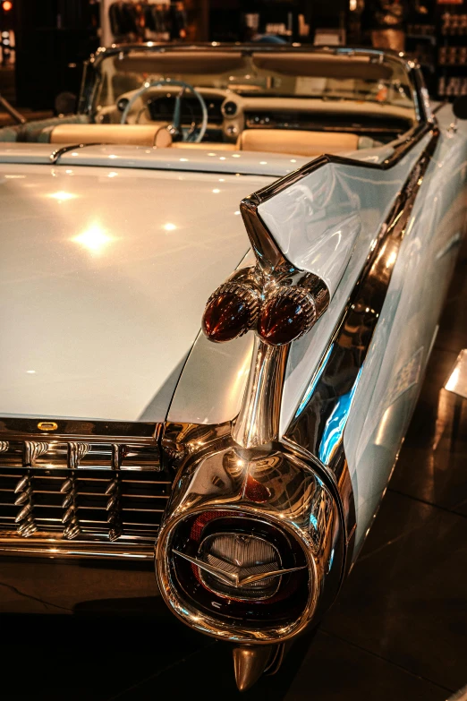 an antique car and other vehicles on display in a car show