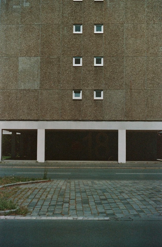 a street with a stop sign on it and some windows