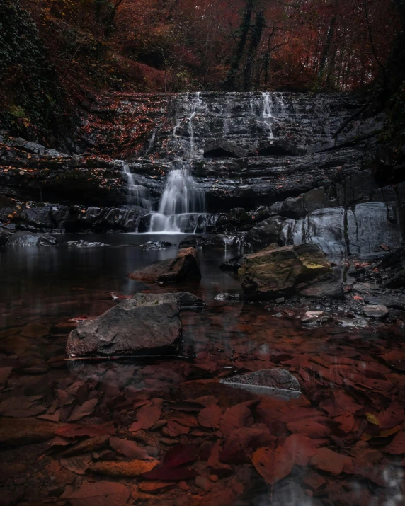 an image of a waterfall in the woods