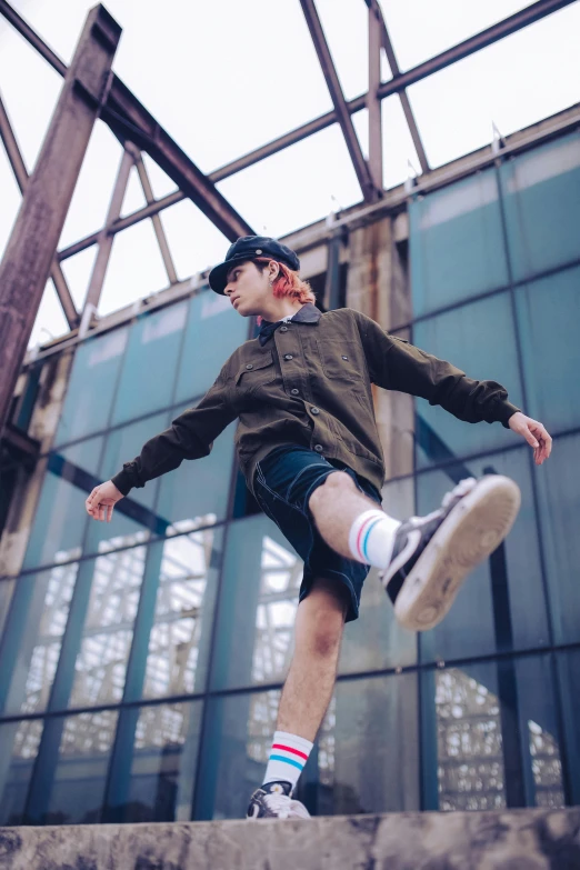 boy performing a skateboard trick on the top of an indoor area