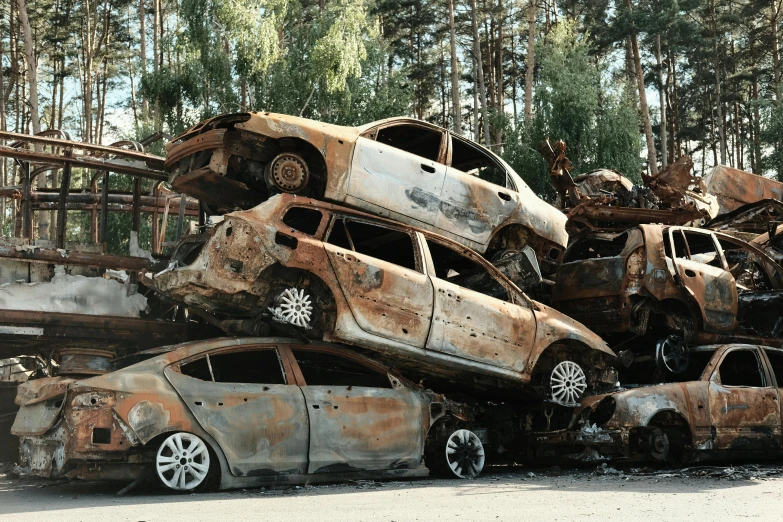 some cars are stuck in the piles of rusty junk
