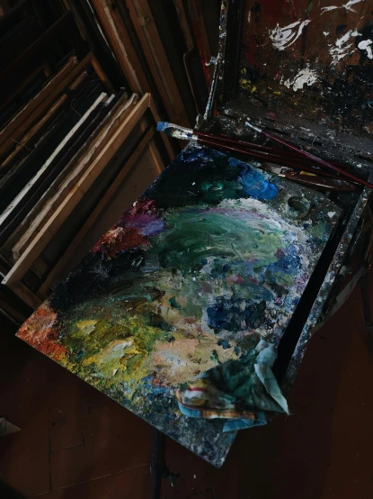 an empty canvas sitting on top of an art easel