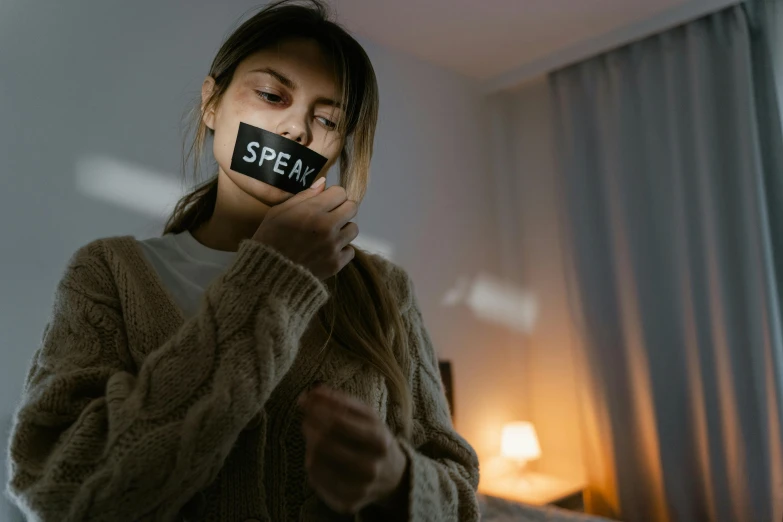 a woman taking a po of herself while holding up her camera