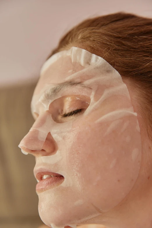 an image of a woman with clear facial mask on