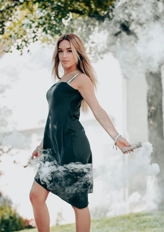 a girl in dress smoking a cigarette with white smoke