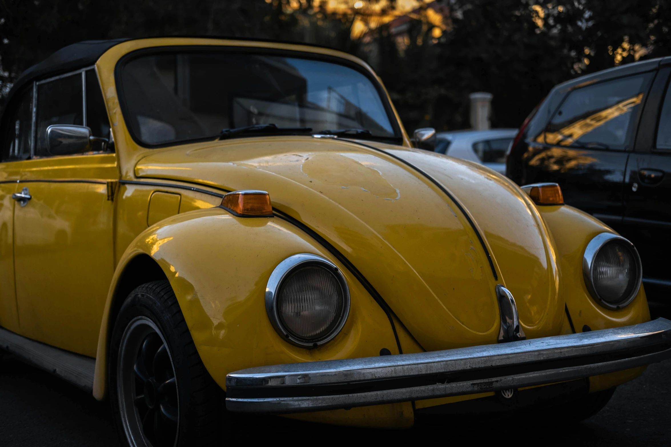 the car is yellow with a chrome grill