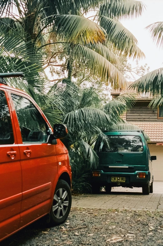 a small van parked next to another van