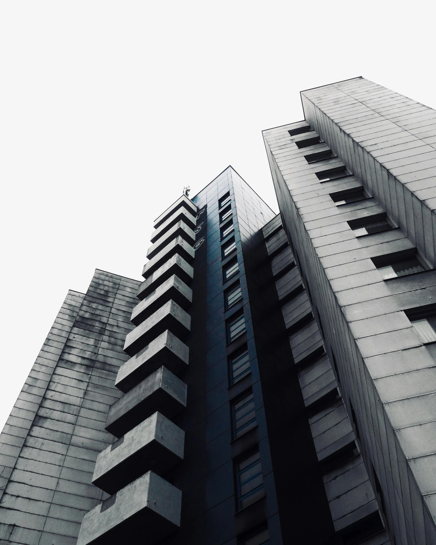 a tall building with many windows and two floors