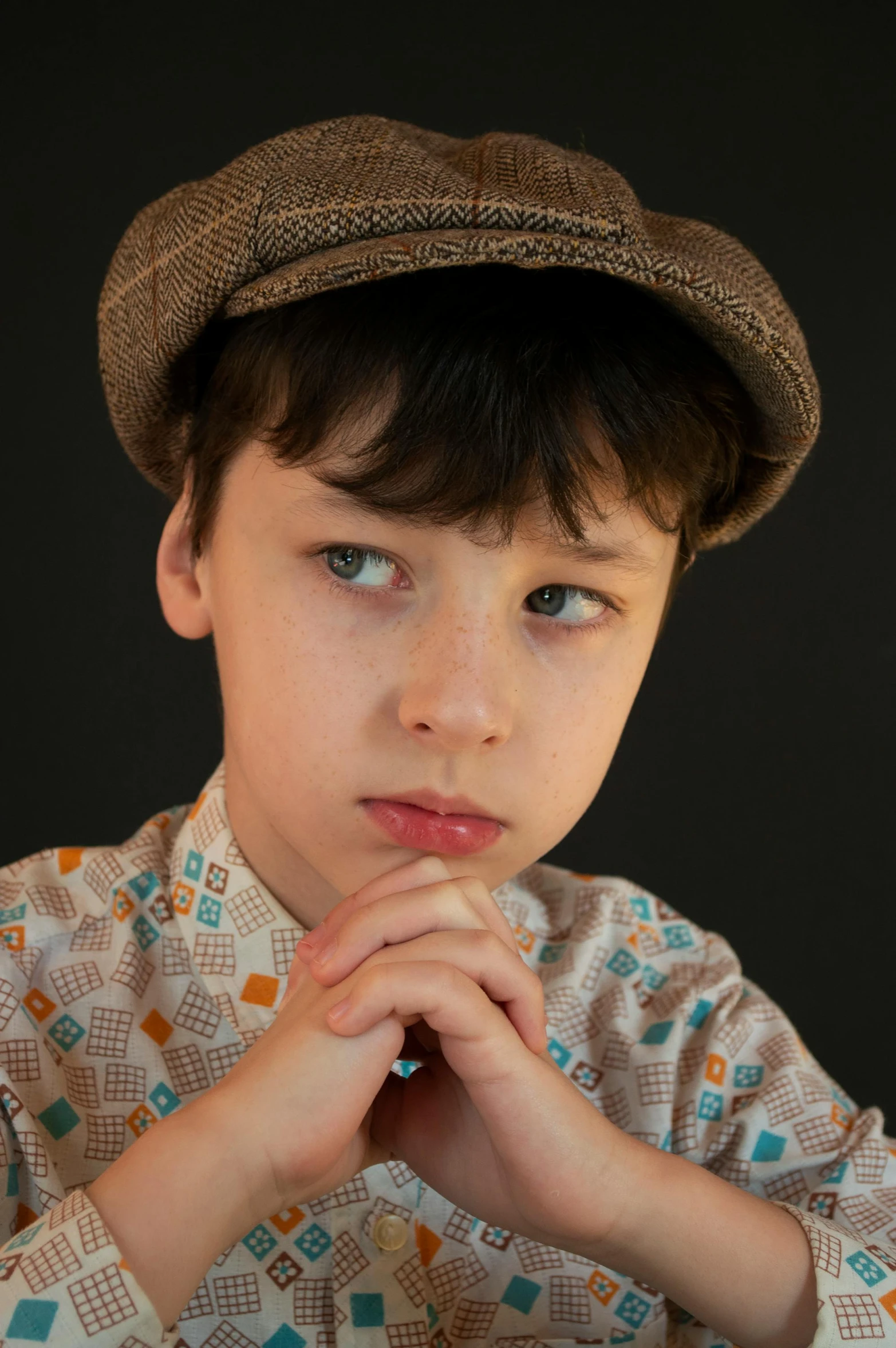 a  with a hat on staring into the camera