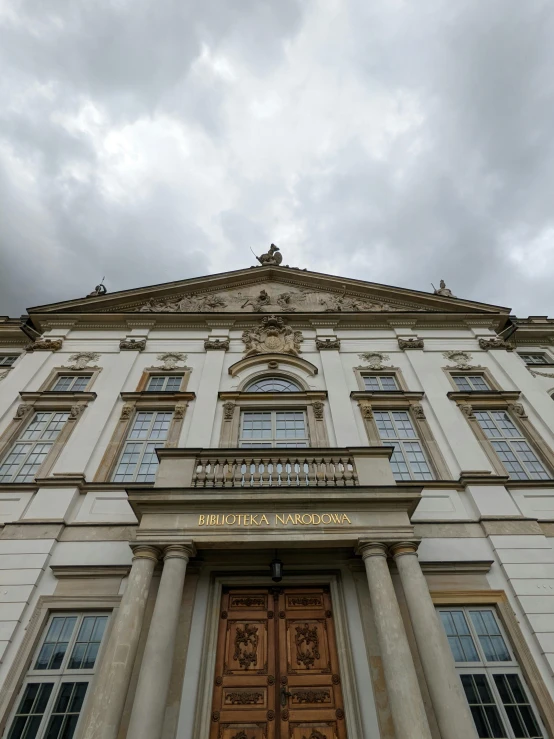 an old building with two windows and the front door